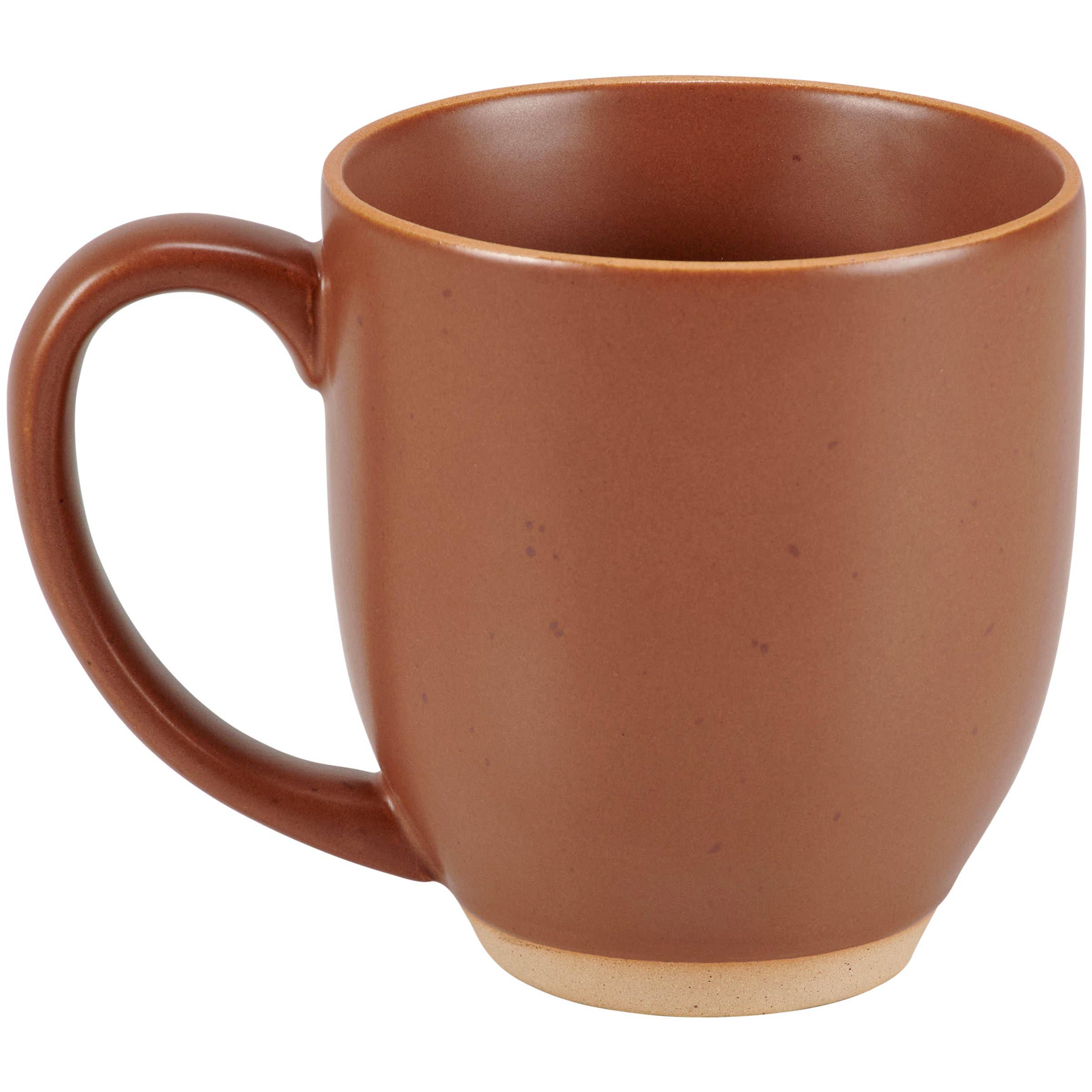 Red farmhouse coffee mug on rustic tabletop.