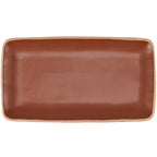 Rustic ceramic serving tray with bare rim and handcrafted texture.