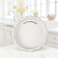 White stoneware pie plate with Slice of Sweetness sentiment.