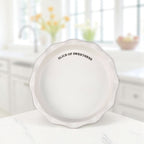 White stoneware pie plate with Slice of Sweetness sentiment.