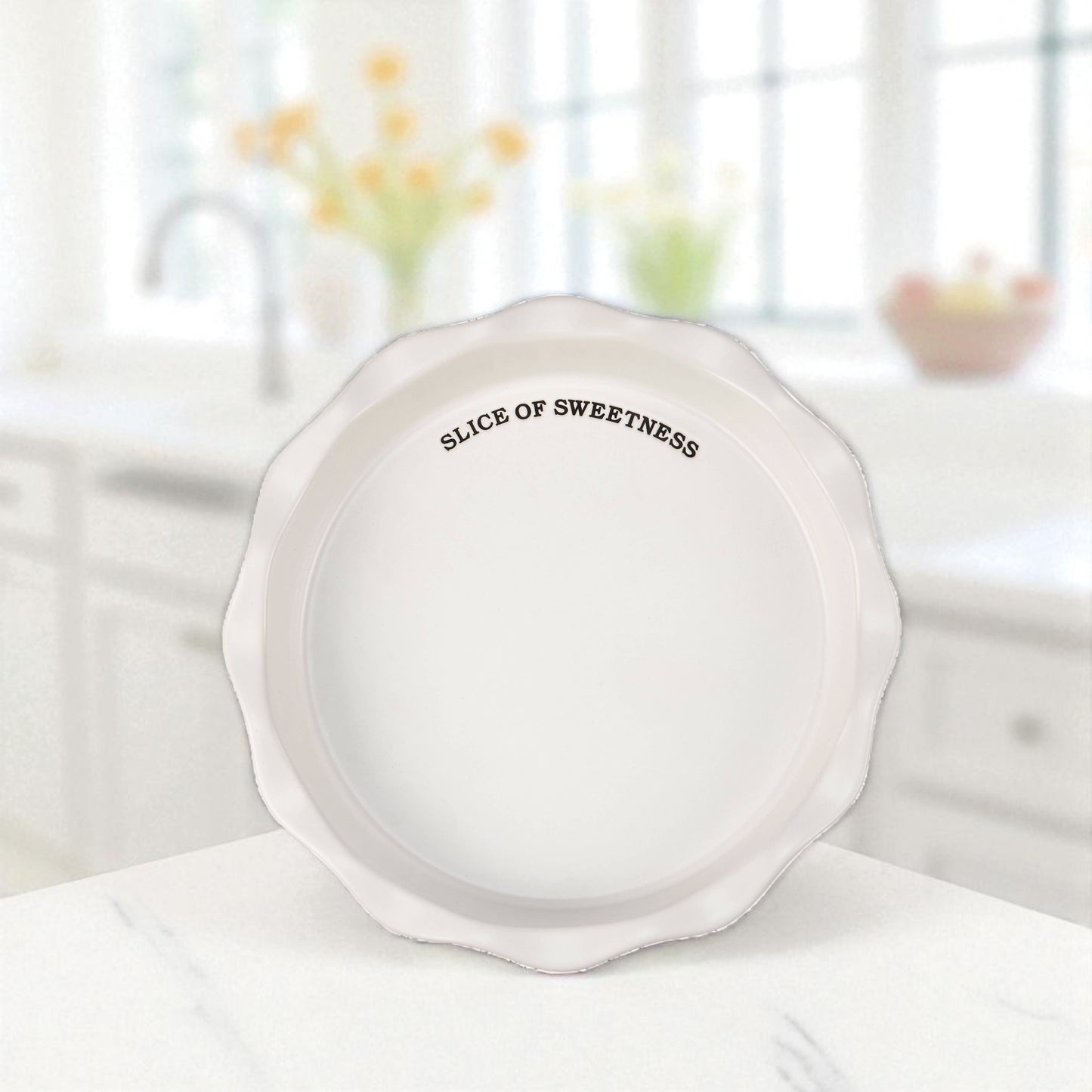 White stoneware pie plate with Slice of Sweetness sentiment.