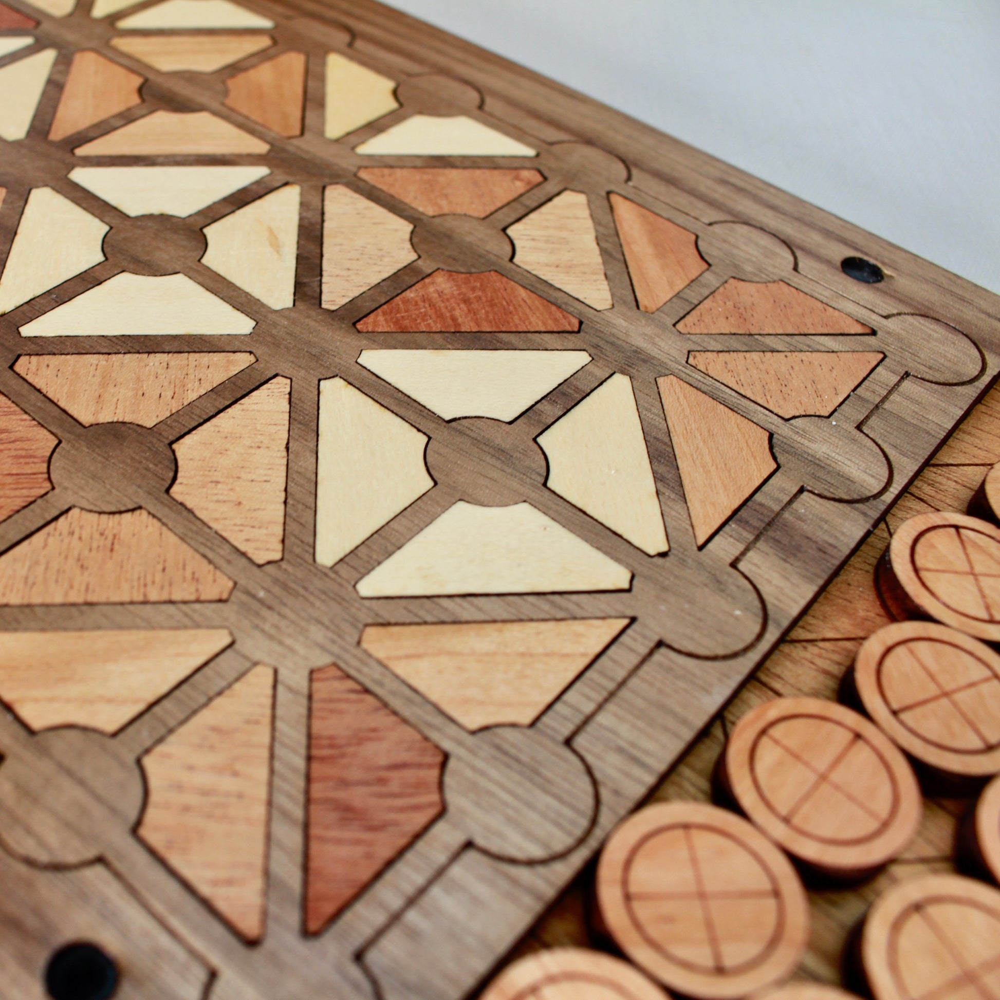 Handcrafted two-player strategy board game made from natural woods.