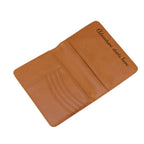 Leatherette passport wallet styled with travel essentials for corporate gifting.