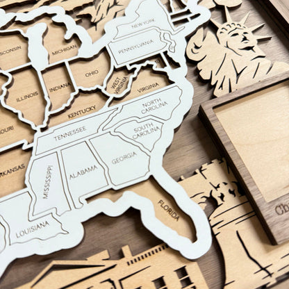 Wooden cutout of the United States with state names on a wooden surface