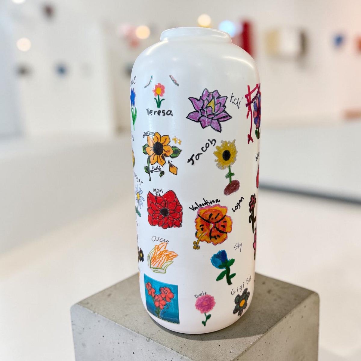 Personalized vase UV printed with colorful hand-drawn illustrations and names.
