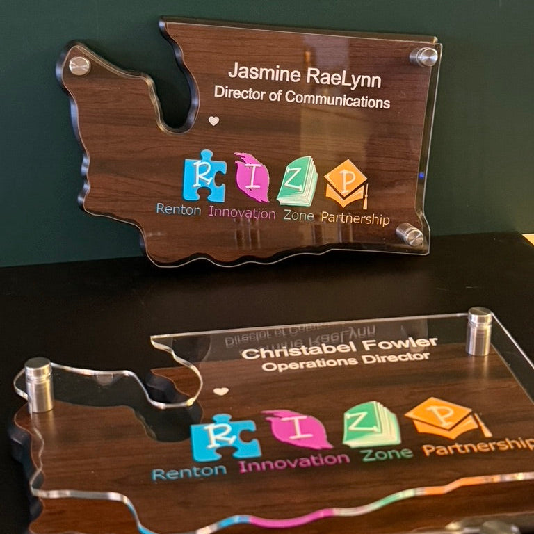 Custom wood and acrylic recognition plaques with full-color UV-printed branding and personalized names.