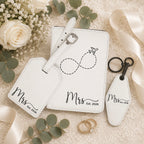 White leatherette wedding travel set with luggage tag, passport holder, and keychain in gift box.