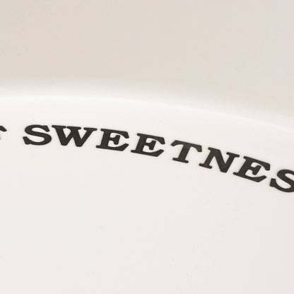 White ceramic bakeware pie pan perfect for dessert serving.