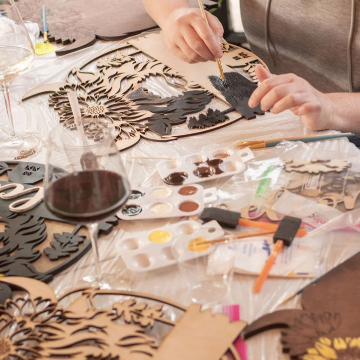 DIY creative class in Renton featuring handmade wooden welcome signs.