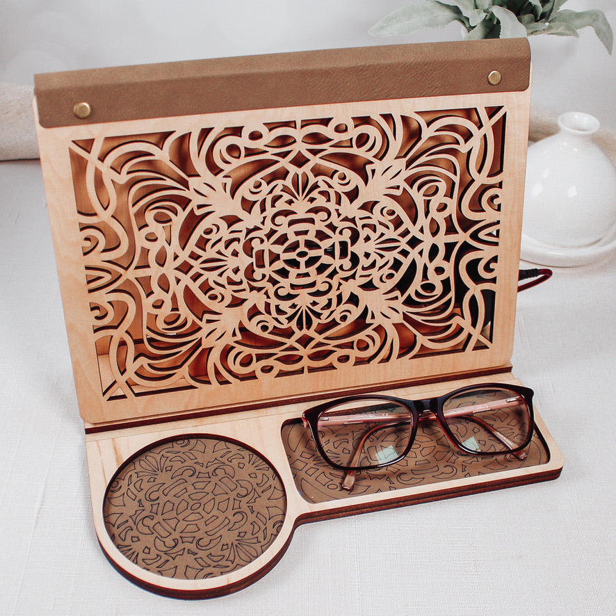 Wooden book stand featuring engraved artwork and lower storage compartment