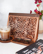 Laser engraved book holder displayed with coffee mug for reading nook